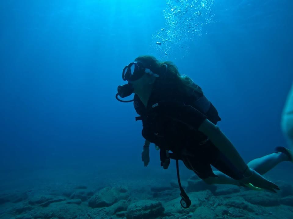 Diver in deep blue at Mononaftis Bay